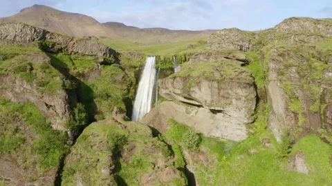 Waterfall Gljufrabui hidden in a small canyon, cliff with bird, seagull, raven Stock Footage 138739068