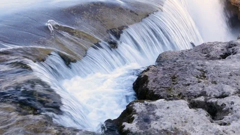 Waterfall in golden rays of sun 스톡 동영상 74075428