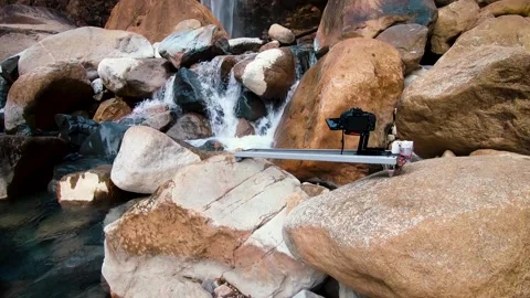 A waterfall gracefully descends amid the mountains and rocks of Meghalaya,India. Stock-Footage 258372886