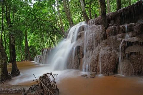 Waterfall in green forest Stock Photos
