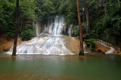 Waterfall in green forest Stock Photos