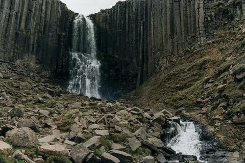 Waterfall in Green River Through Studlagil basalt canyon, Iceland Stock Photos