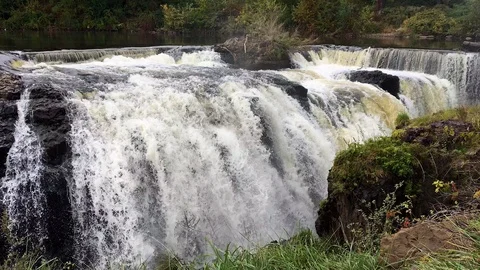 Waterfall Gushes Over Basalt Cliffs Stock Footage 98416227
