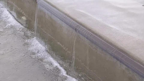 Waterfall gushing over the edge in the downtown Bellevue park waterfall fount Stock Footage 122081045