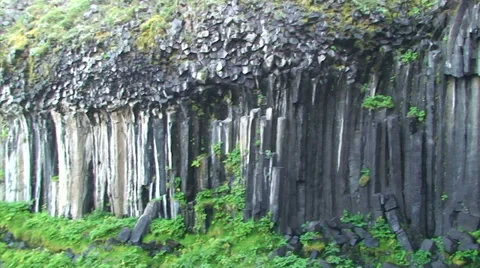 Waterfall with hexagonal basalt columns geologic formation Stock Footage 37986660