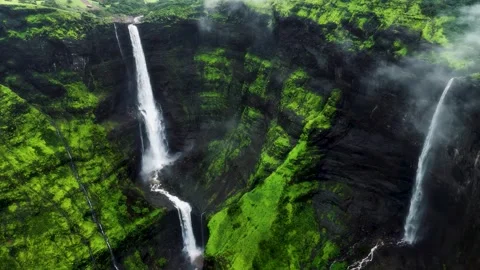 Waterfall hidden in rainforest jungle (Drone Shot). Video stock 282072885