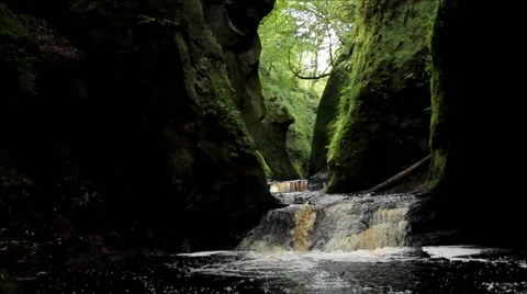 Waterfall in a Hidden Valley, filmed at Devil's Pulpit, Finnich Glen 스톡 동영상 56305404