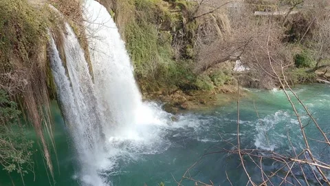 Waterfall high, water falls down into river on clear day Stock Footage 246851234