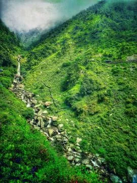 Waterfall on hill Stock Photos