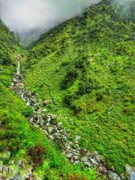 Waterfall on hill Stock Photos