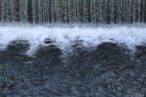 Waterfall with a huge current, mountain waterfall. Stock Photos