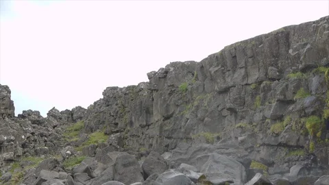 Waterfall in Iceland, surrounded by rocks and moss Stock Footage 86754426