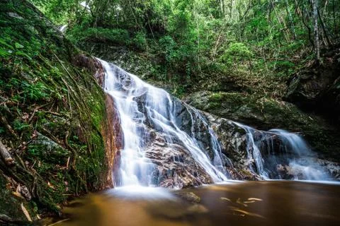 Waterfall inside tropical rainforest Stock Photos