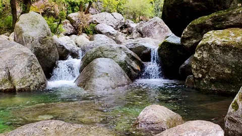 Waterfall jheel Cafe Mountain river flows high in the mountains Stock Footage 304698603