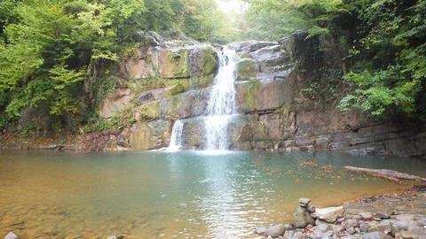 Waterfall into jungle Stock Photos