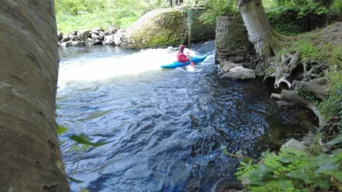 WaterFall with Kayaking Guy Stock Footage 153519340