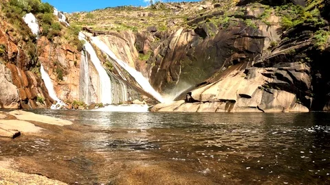 WATERFALL LAKE MOUNTAIN SUN Stock Footage 91039637