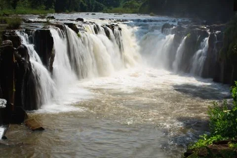 Waterfall in Laos with red water Stock Photos