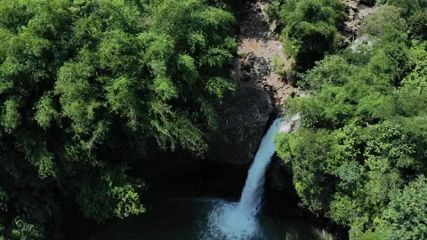 Waterfall Lontar has a height of 35 meters and is a source of hydropower power Stock Footage 147427157