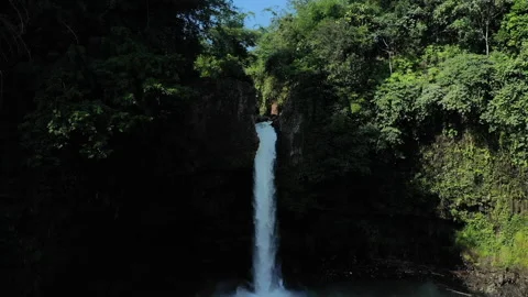 Waterfall Lontar has a height of 35 meters and is a source of hydropower power Stock Footage 147427225