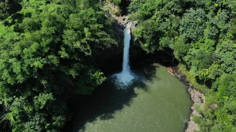 Waterfall Lontar has a height of 35 meters and is a source of hydropower power Stock Footage 147427807