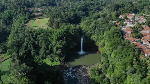 Waterfall Lontar has a height of 35 meters and is a source of hydropower power Stock Footage 147428558
