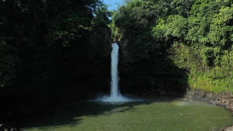 Waterfall Lontar has a height of 35 meters and is a source of hydropower power Stock Footage 147428570