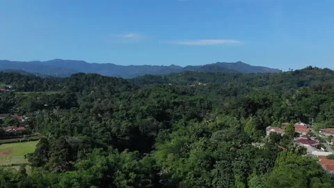 Waterfall Lontar has a height of 35 meters and is a source of hydropower power Stock Footage 147428835