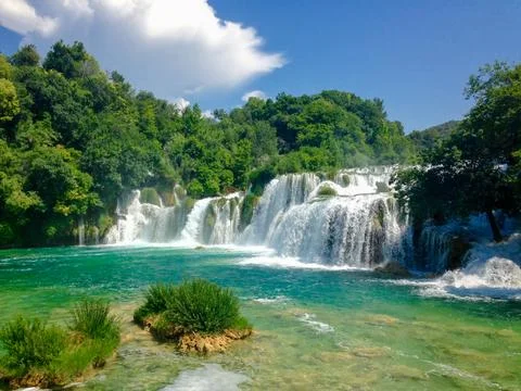 Waterfall in Lush Forest Stock Photos