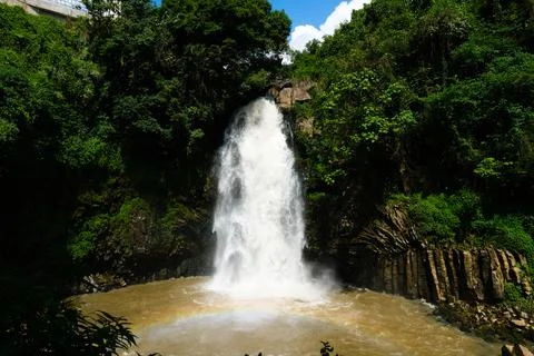Waterfall in lush tropical forest Stock Photos