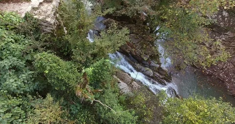 WATERFALL IN THE LUSH VALLEY Stock Footage 110773134