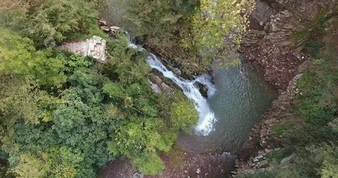 WATERFALL IN THE LUSH VALLEY Stock Footage 110773218
