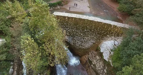 WATERFALL IN THE LUSH VALLEY Stock Footage 110773685