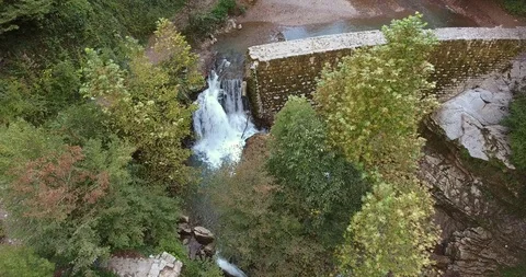 WATERFALL IN THE LUSH VALLEY Stock Footage 110774384