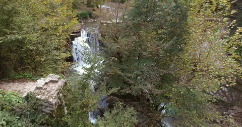 WATERFALL IN THE LUSH VALLEY Stock Footage 110775239