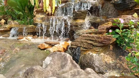 Waterfall with many layers of beautiful rocks Stockbeeldmateriaal 263443476