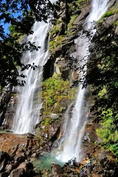 Waterfall in the middle of the forest Stock Photos