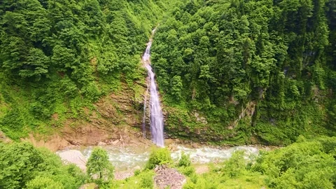 Waterfall in the middle a lush green. Stock Footage 284689001