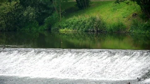 Waterfall with Mirrored Landscape Stock Footage 784987