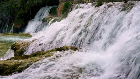Waterfall with mossy rocks Stock Footage 153536915