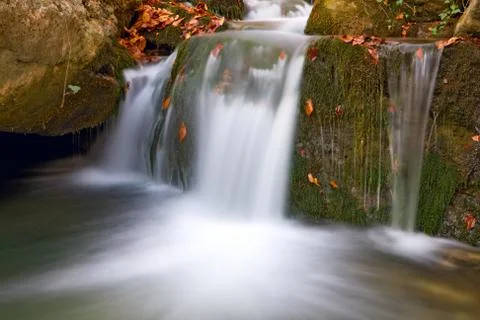 Waterfall on mountain brook Stock Photos