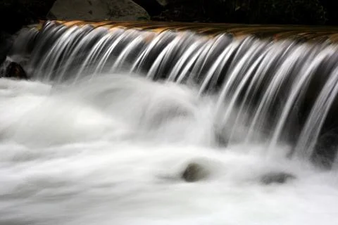 Waterfall on mountain brook Stock Photos