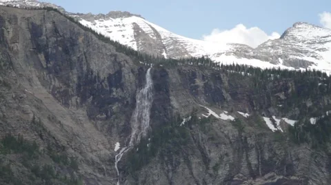 Waterfall on mountain in the distance Stock Footage 48276485