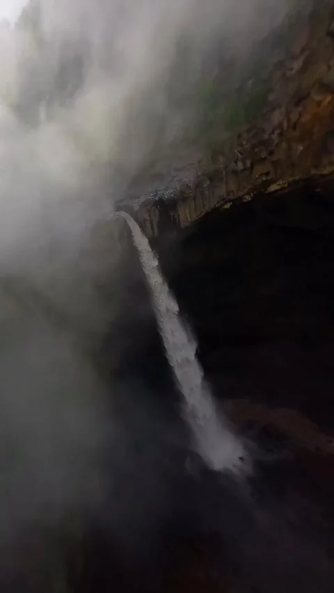 Waterfall in mountain with fog Stock Footage 272290194