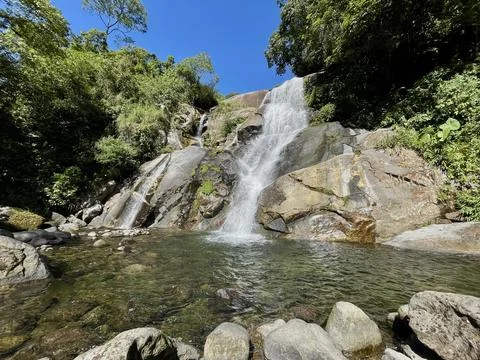 Waterfall in the mountain forest Stock Photos