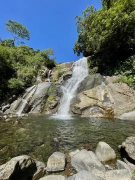 Waterfall in the mountain forest Stock Photos