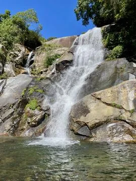 Waterfall in the mountain forest Stock Photos