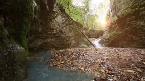 Waterfall in mountain forest with sun Stock Footage 43307248