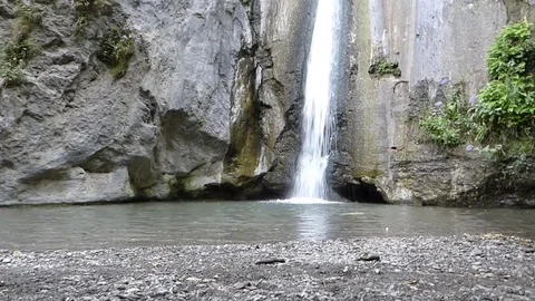 Waterfall in a mountain lake Stock Footage 82405355
