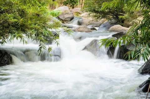 Waterfall on the mountain. Stock Photos